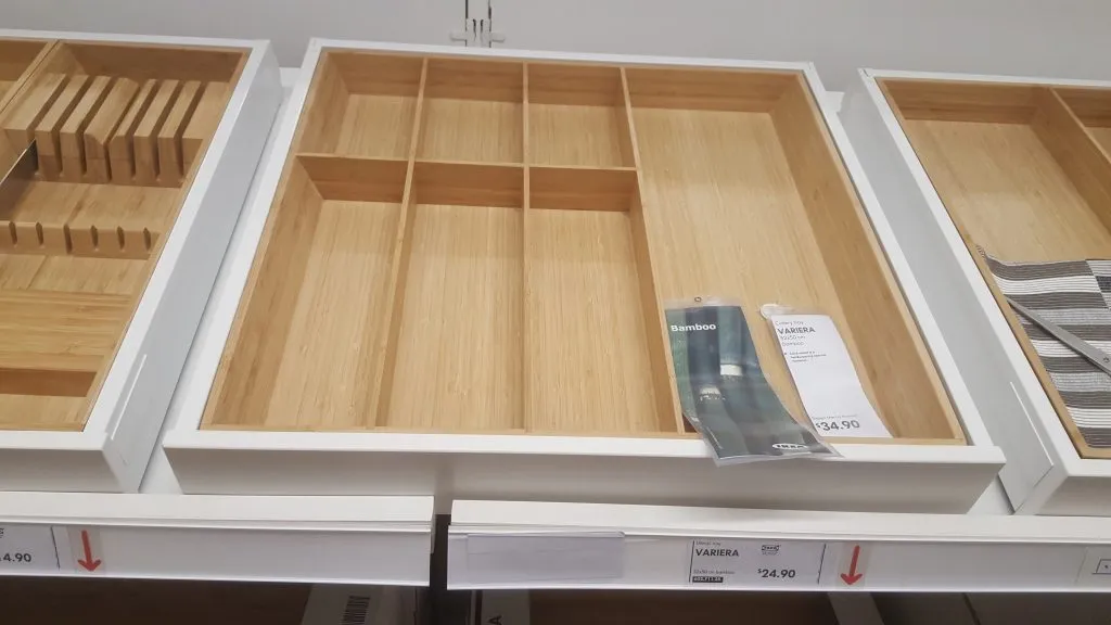 We chose to buy the bamboo utensils tray rather than the plastic one. At $25, it’s much more expensive but the look fits much better.