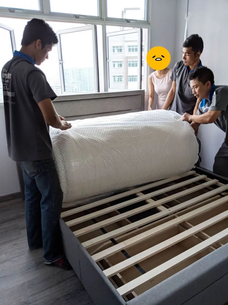 The guys laid the planks on top, and once everything was ready they unpacked the bed onto the bed frame. I think PQ was trying to communicate to help them manage the rolling out of the mattress.