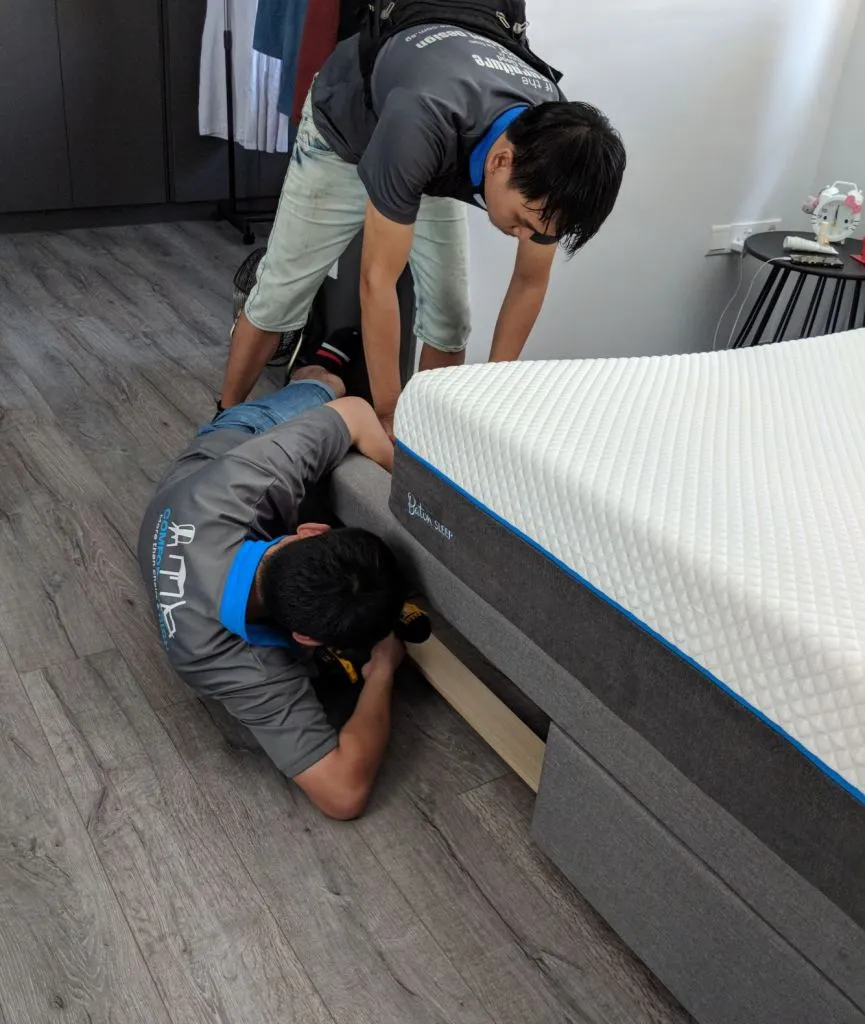 The guys fixing the misalignment of the drawers. They had to work on it for around 20 mins, but eventually they did it to an acceptable standard.