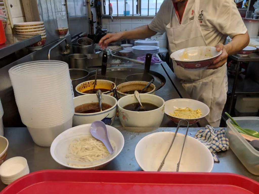 Uncle preparing to cook our long-awaited noodle.