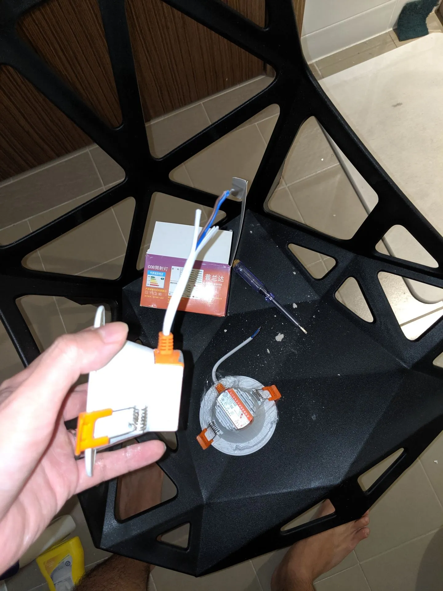 The light bulb, loosened from its unity with the controller or cables from the ceiling