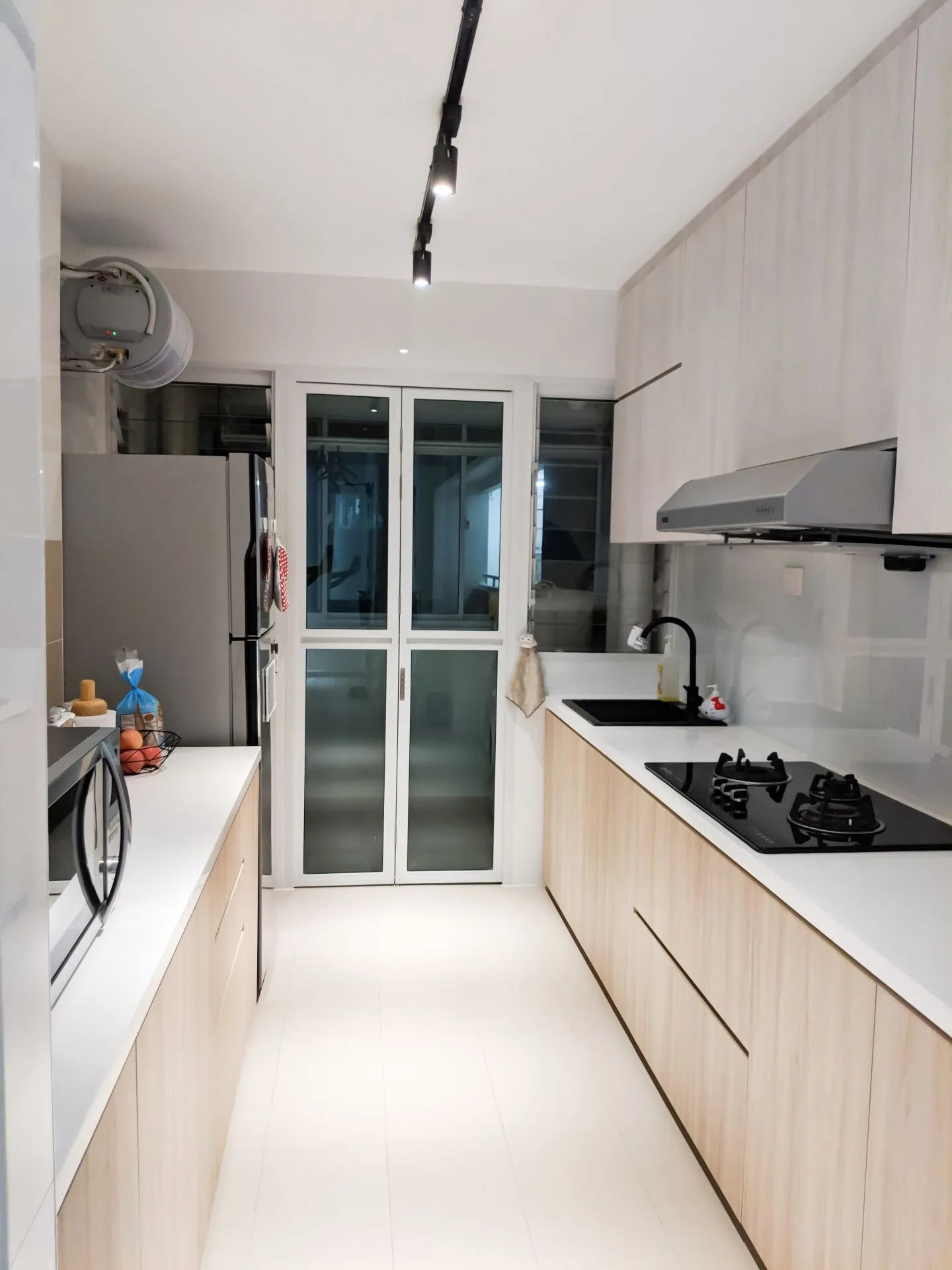 We intended our kitchen to be low cost to build, minimalistic, and fuss free to maintain. The hood is something that works decently but probably should’ve been changed to something that looks more boxy. We also opted against having a built in oven. It was a great choice because our Sharp Microwave Oven works very well.